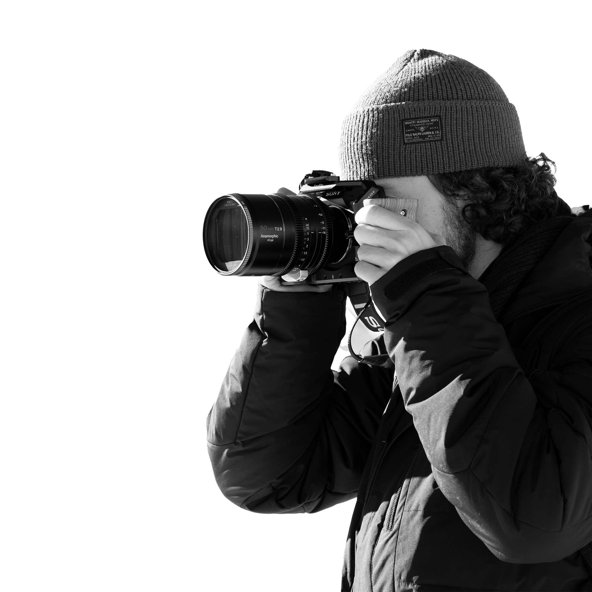 man looking inside the viewfinder of a camera aimed to the left side