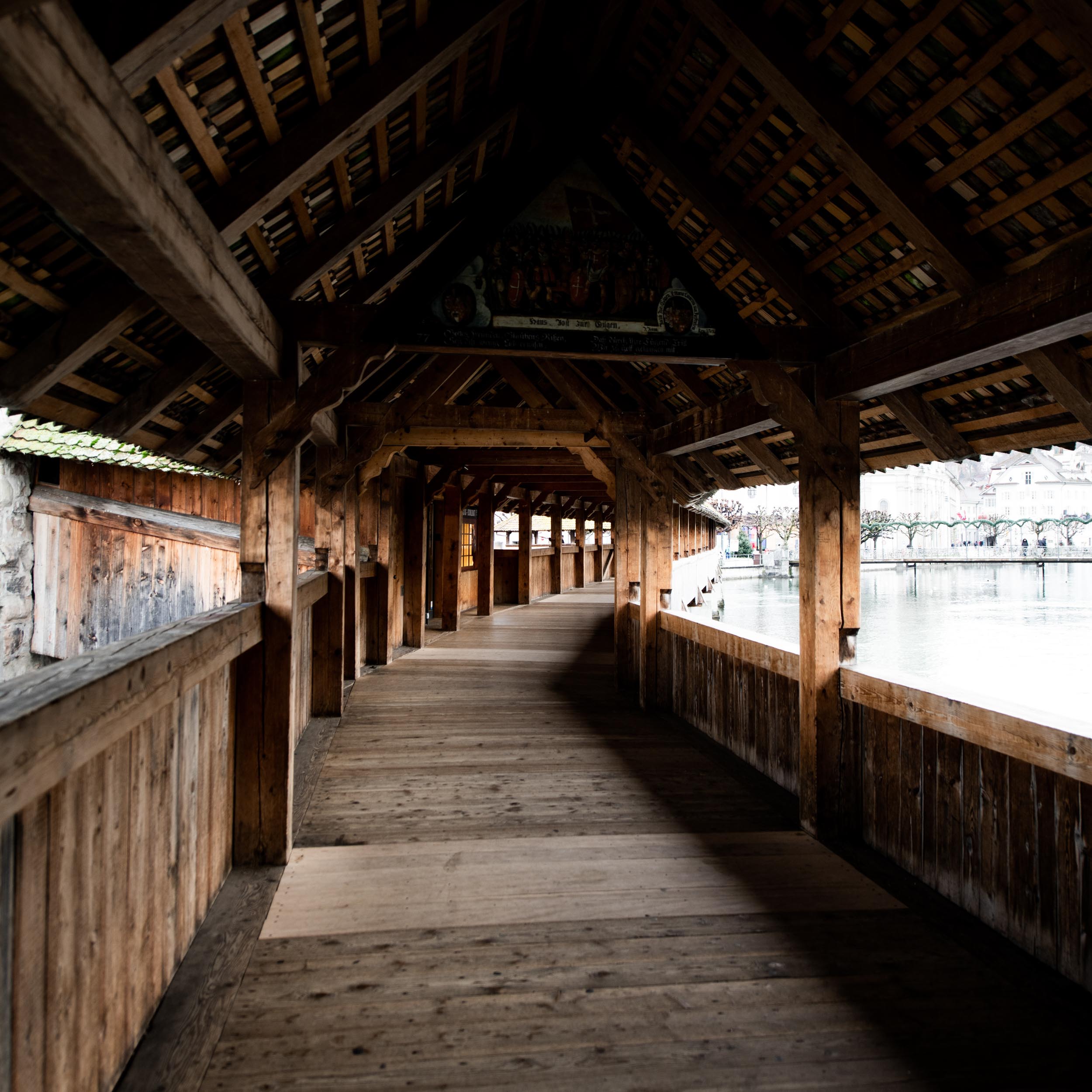 a wooden bridge crossing a river