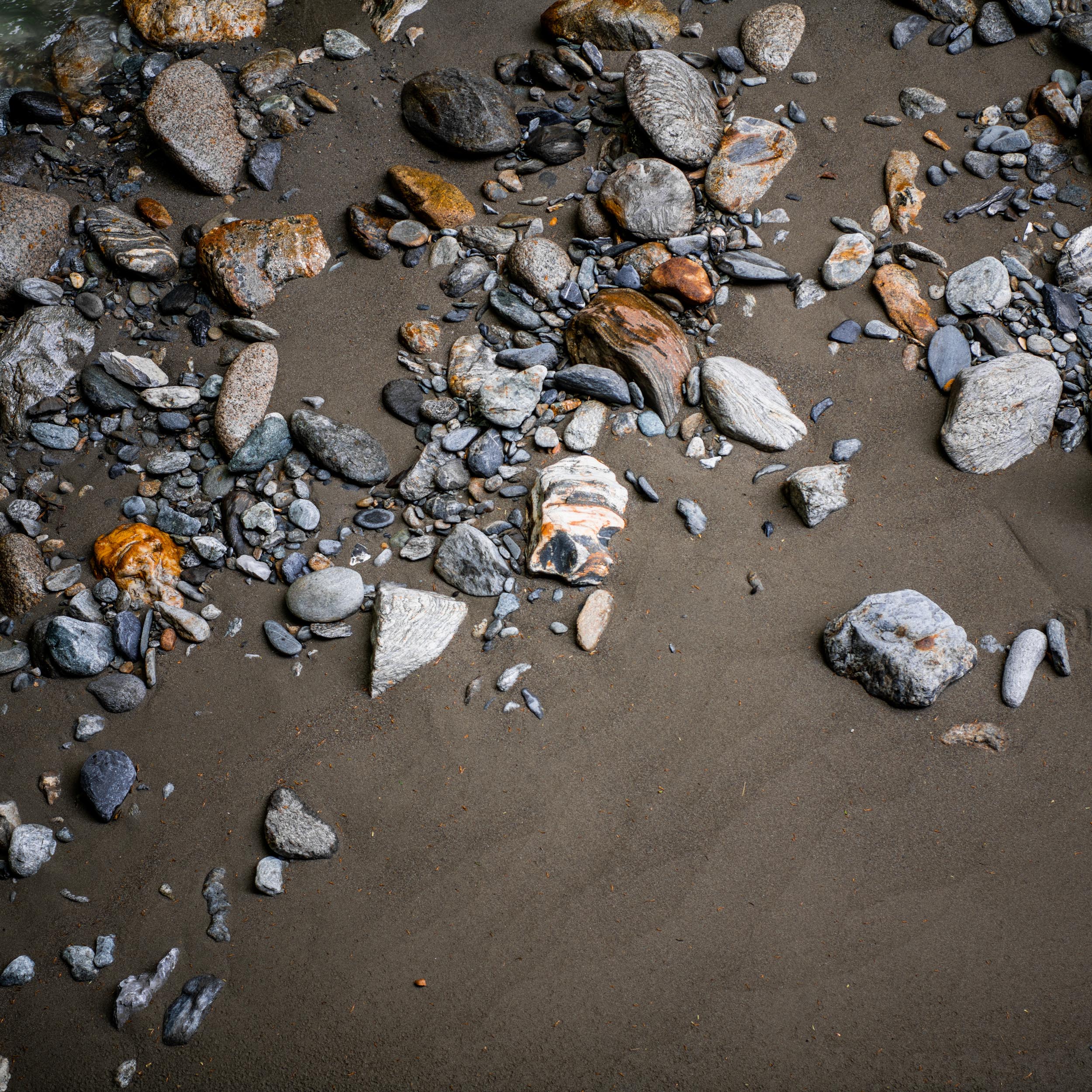 stones laying in the sand
