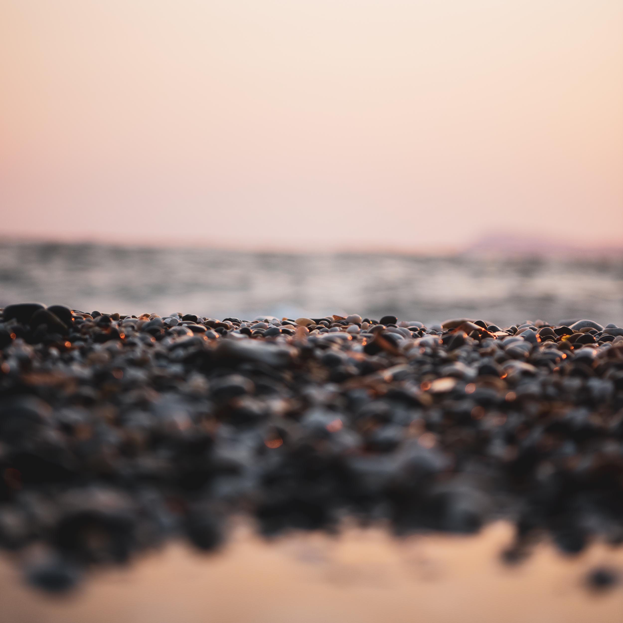 pebble beach with waves in the background