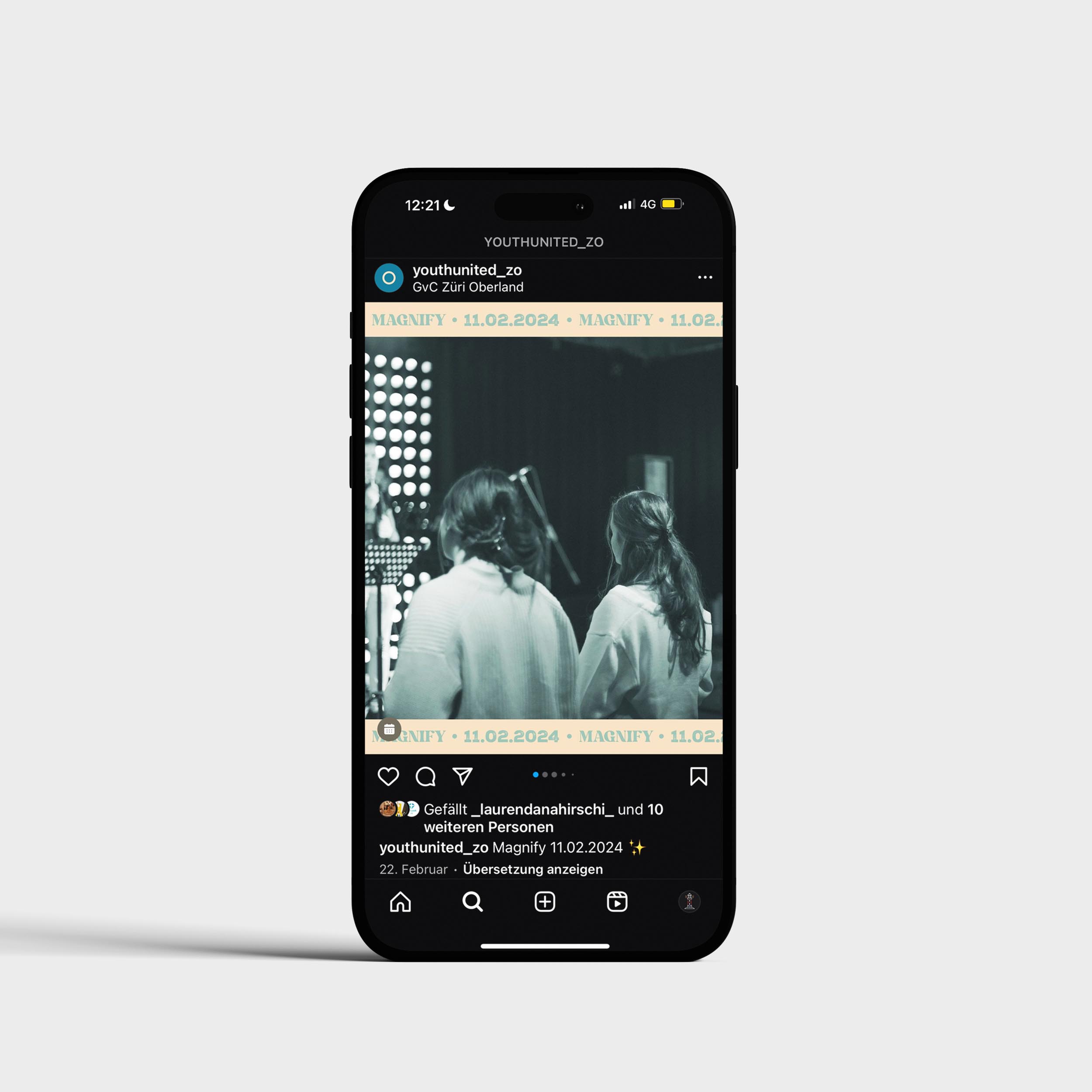 iphone with a social media post on screen